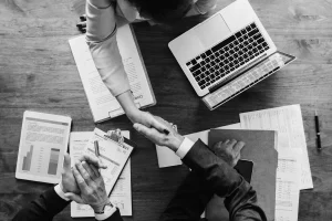 Accountant for startup business setup welcoming a new client at the office